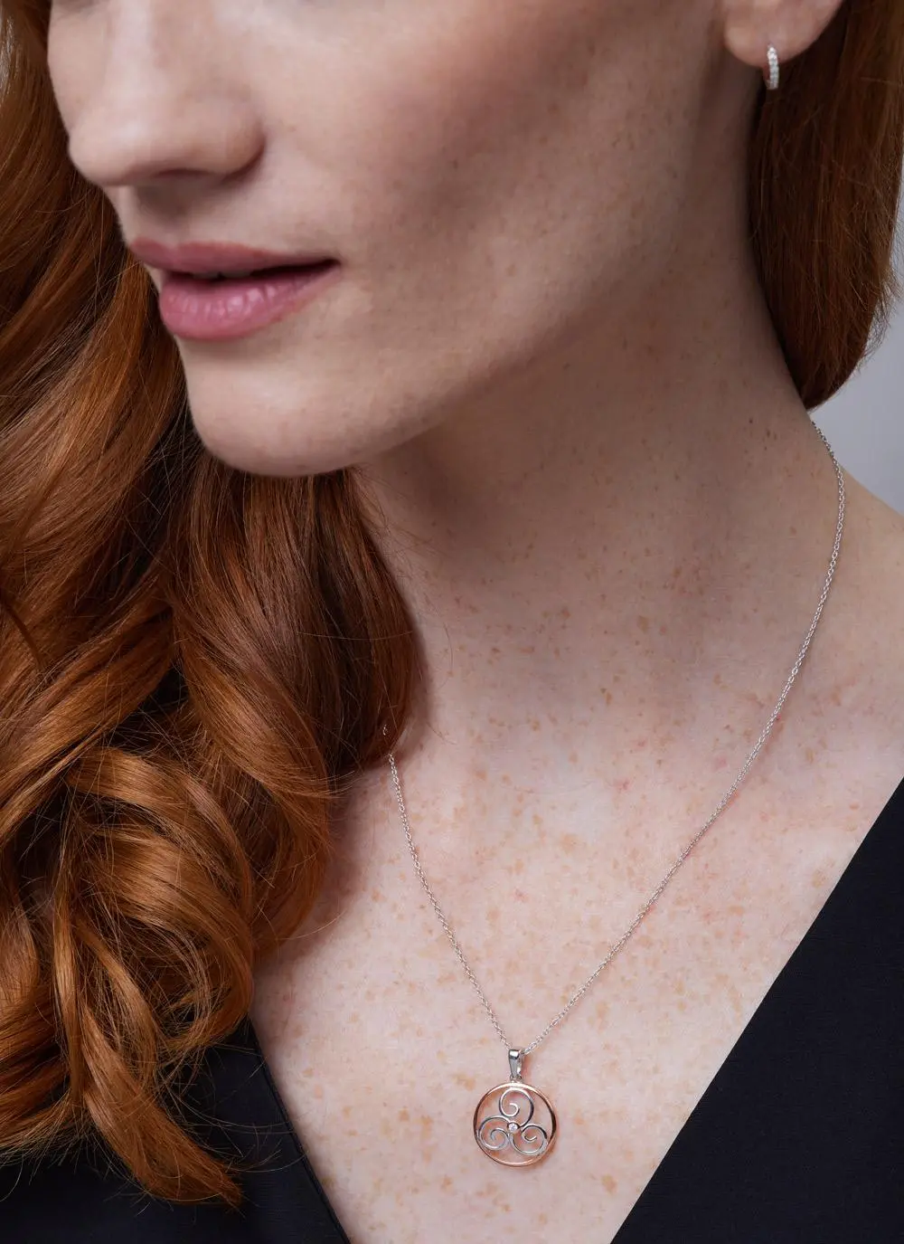 Close up shot of red haired model wearing Sterling Silver 